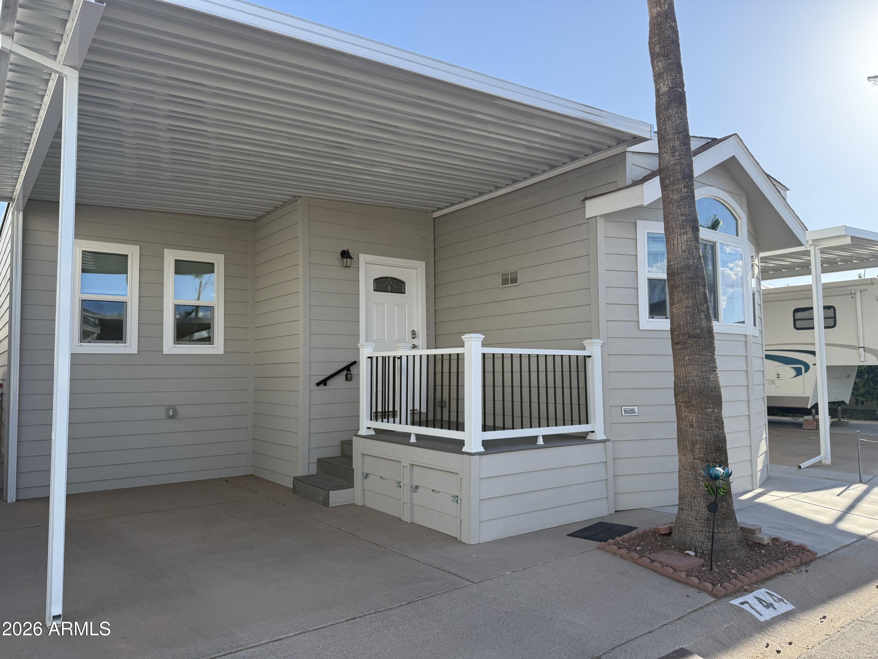 744 Emerald Drive Apache Junction, AZ 85119 - Photo 2 of 25 a view of a house with a fence