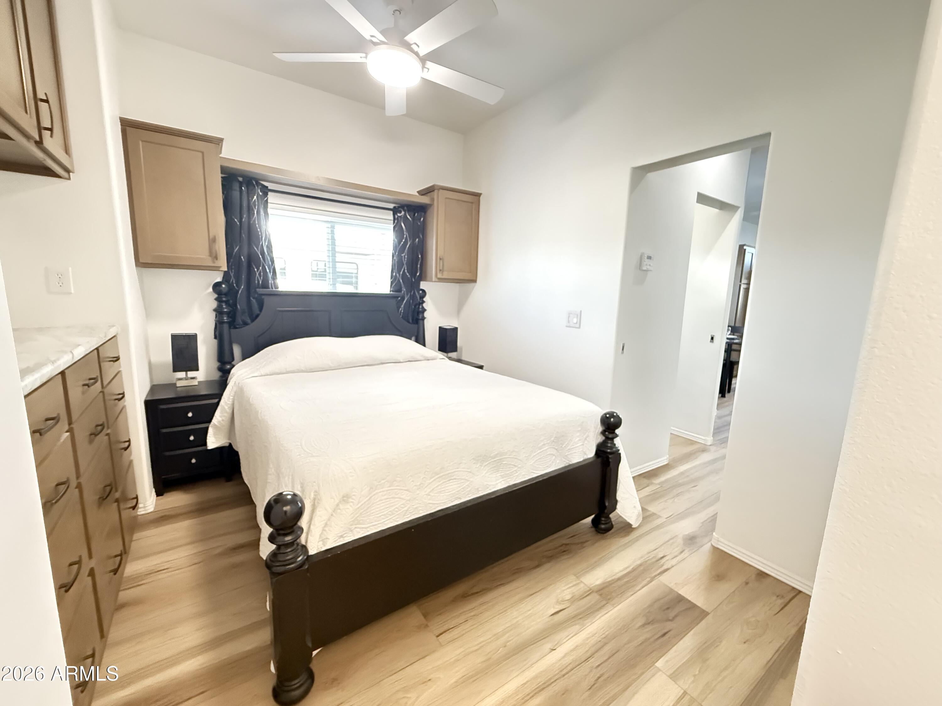 744 Emerald Drive Apache Junction, AZ 85119 - Photo 21 of 25 a bedroom with a bed dresser and a window