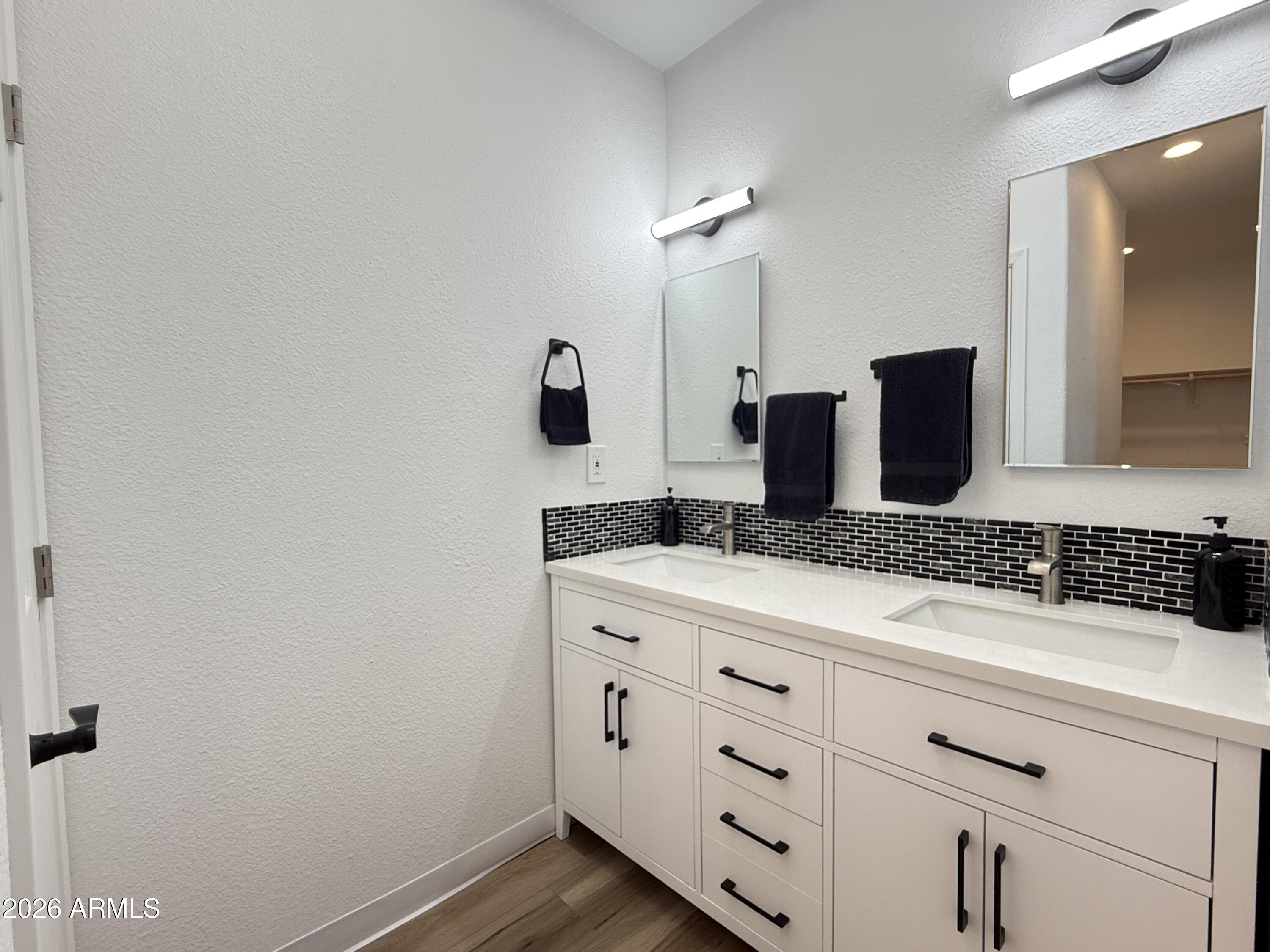 744 Emerald Drive Apache Junction, AZ 85119 - Photo 23 of 25 a bathroom with a granite countertop sink and a mirror
