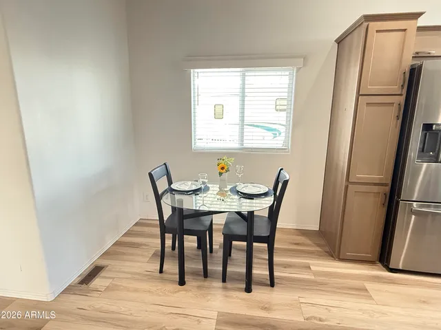 a view of a dining room with furniture window and wooden floor