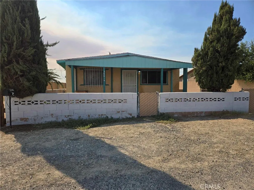 36614 Leona Road Barstow, CA 92311 - Photo 1 of 24 a view of a house with a yard and garage