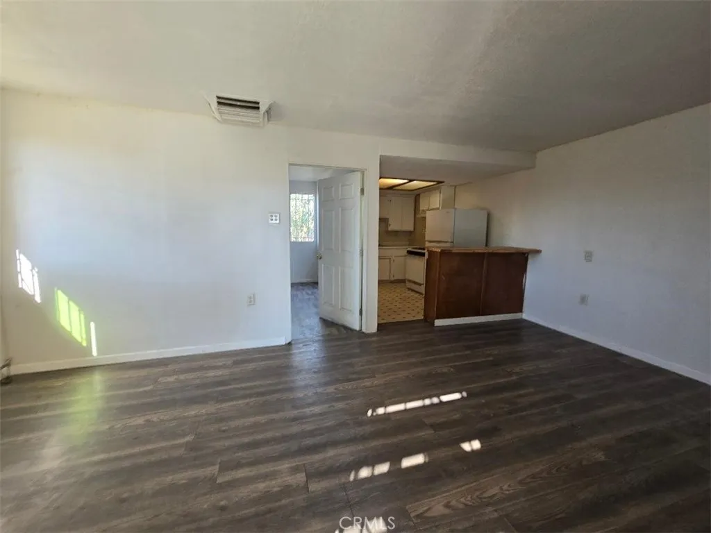 36614 Leona Road Barstow, CA 92311 - Photo 21 of 24 a view of empty room with wooden floor