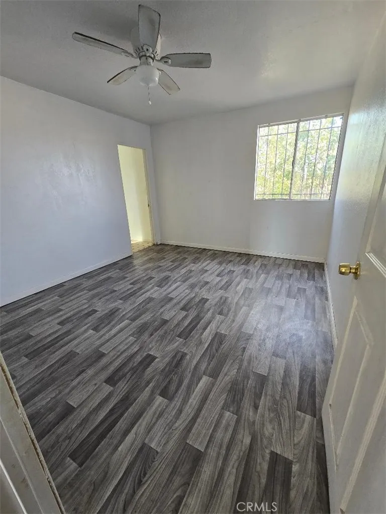 36614 Leona Road Barstow, CA 92311 - Photo 23 of 24 wooden floor in an empty room with a window