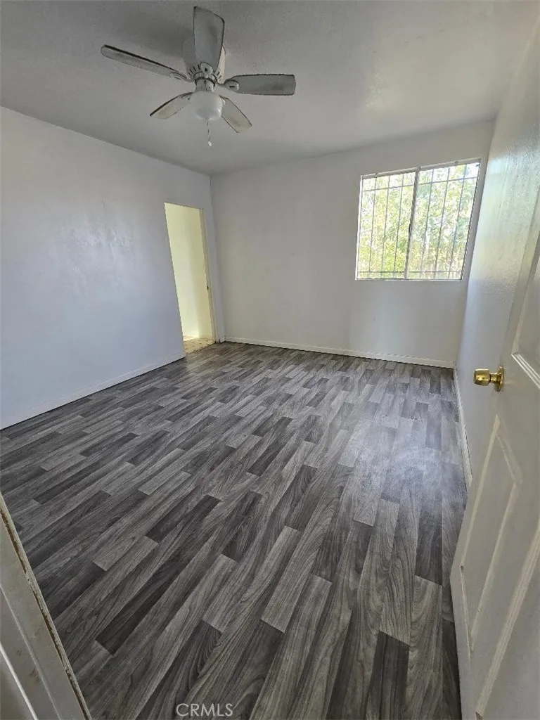 36614 Leona Road Barstow, CA 92311 - Photo 23 of 24 wooden floor in an empty room with a window