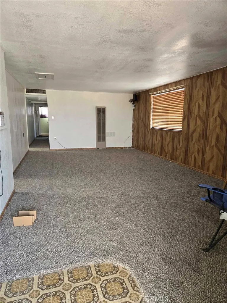 36614 Leona Road Barstow, CA 92311 - Photo 5 of 24 a view of an empty room with a window