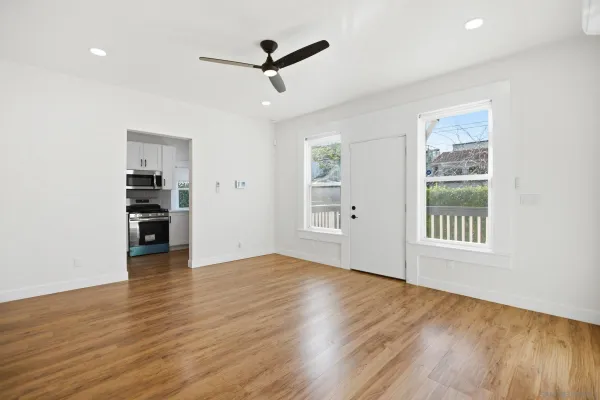 wooden floor in an empty room with a window