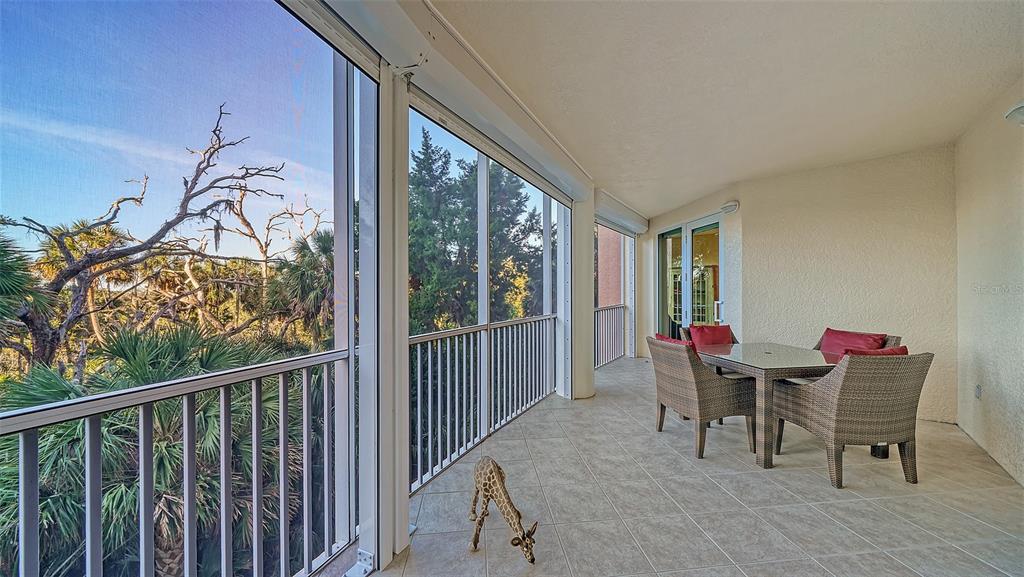 3621 North Point Road, Unit 301 Osprey, FL 34229 - Photo 13 of 95 a view of a dining room with furniture window and outside view