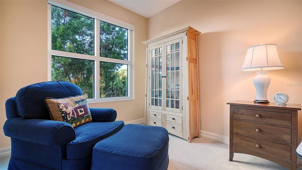 3621 North Point Road, Unit 301 Osprey, FL 34229 - Photo 33 of 95 a living room with furniture and a window