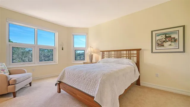 a living room with furniture and a floor to ceiling windows