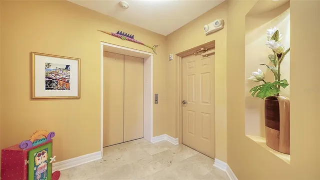 a very nice looking room with a large window and wooden floor