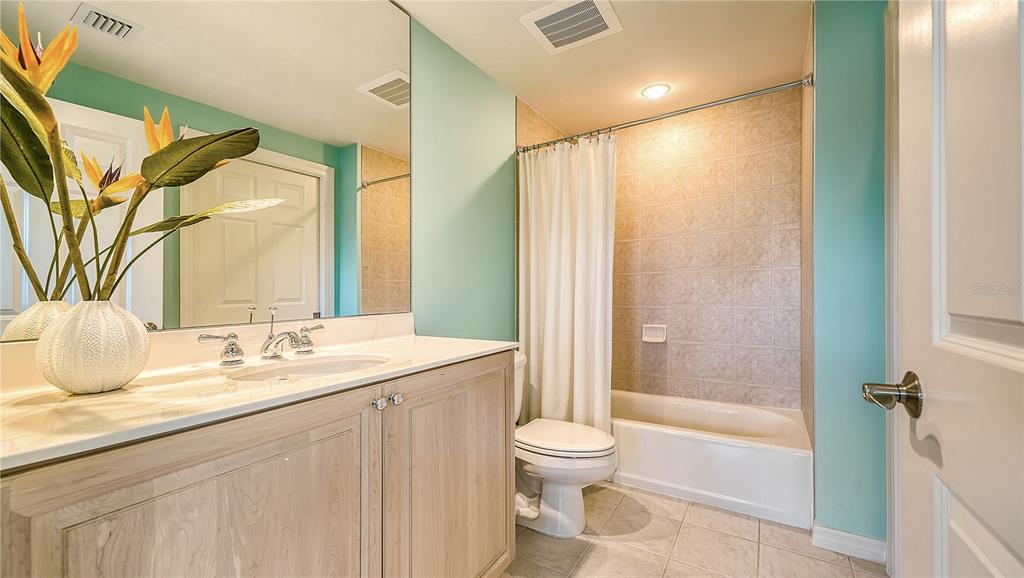 3621 North Point Road, Unit 301 Osprey, FL 34229 - Photo 44 of 95 a bathroom with a granite countertop sink toilet and shower