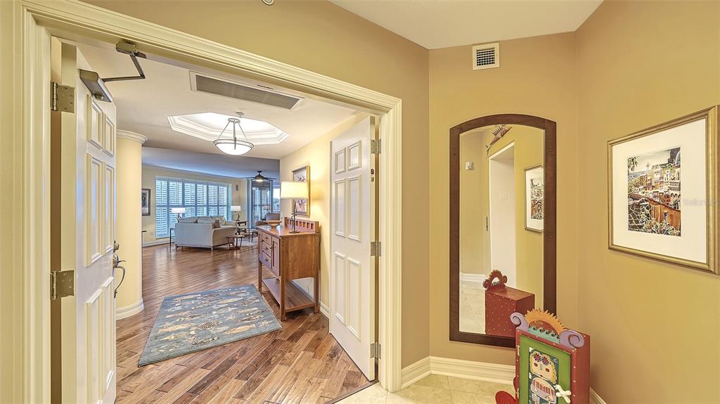 3621 North Point Road, Unit 301 Osprey, FL 34229 - Photo 6 of 95 a very nice looking room with a large window and wooden floor