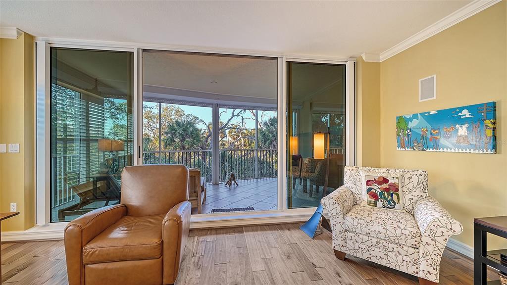 3621 North Point Road, Unit 301 Osprey, FL 34229 - Photo 10 of 95 a living room with furniture and a large window