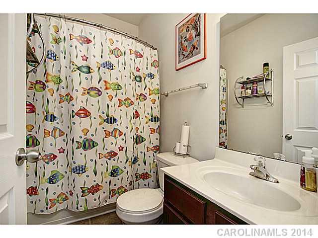 9223 Yellow Oak Road Charlotte, NC 28227 - Photo 13 of 15 a bathroom with a sink toilet and shower