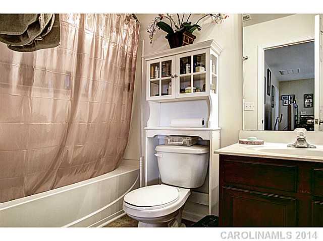 9223 Yellow Oak Road Charlotte, NC 28227 - Photo 14 of 15 a bathroom with a toilet a sink and bathtub