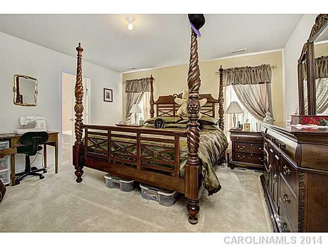 9223 Yellow Oak Road Charlotte, NC 28227 - Photo 8 of 15 a bedroom with furniture and a window
