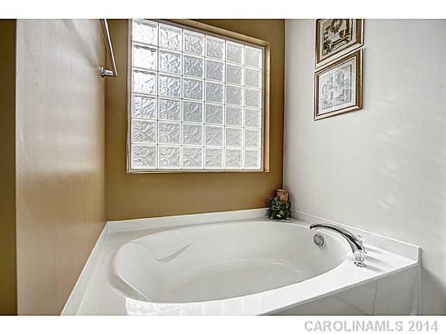9223 Yellow Oak Road Charlotte, NC 28227 - Photo 10 of 15 a bathroom with a bathtub and a window