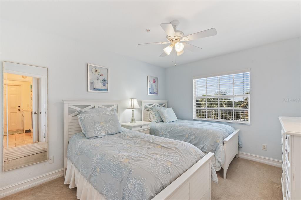 5856 Gasparilla Road, Unit MV28 Boca Grande, FL 33921 - Photo 12 of 21 a bedroom with bed and window