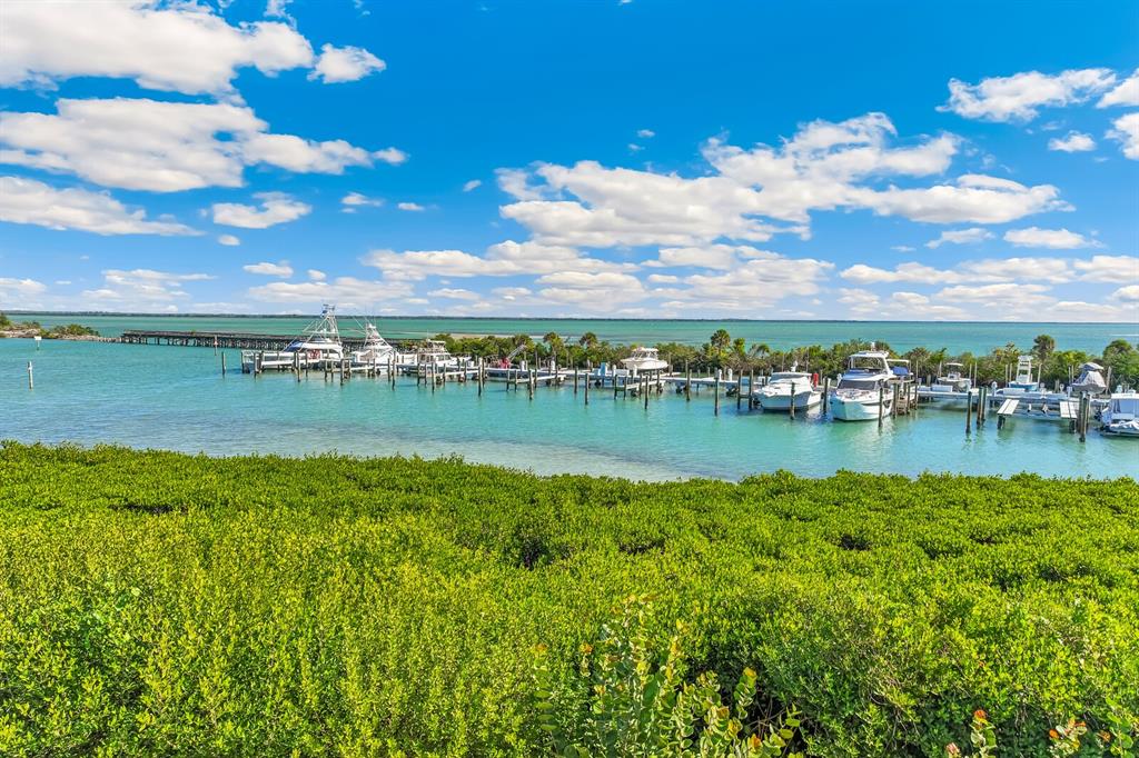 5856 Gasparilla Road, Unit MV28 Boca Grande, FL 33921 - Photo 16 of 21 a view of a lake with houses in the back