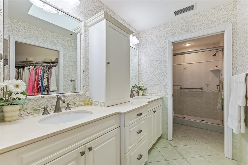 5856 Gasparilla Road, Unit MV28 Boca Grande, FL 33921 - Photo 10 of 21 a bathroom with a granite countertop sink mirror and double
