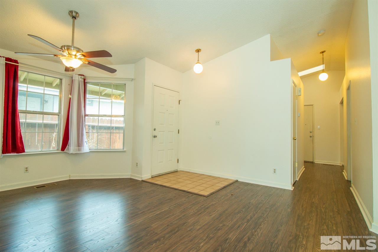 6480 Enchanted Valley Drive Reno, NV 89523 - Photo 5 of 12 a view of empty room with wooden floor and fan