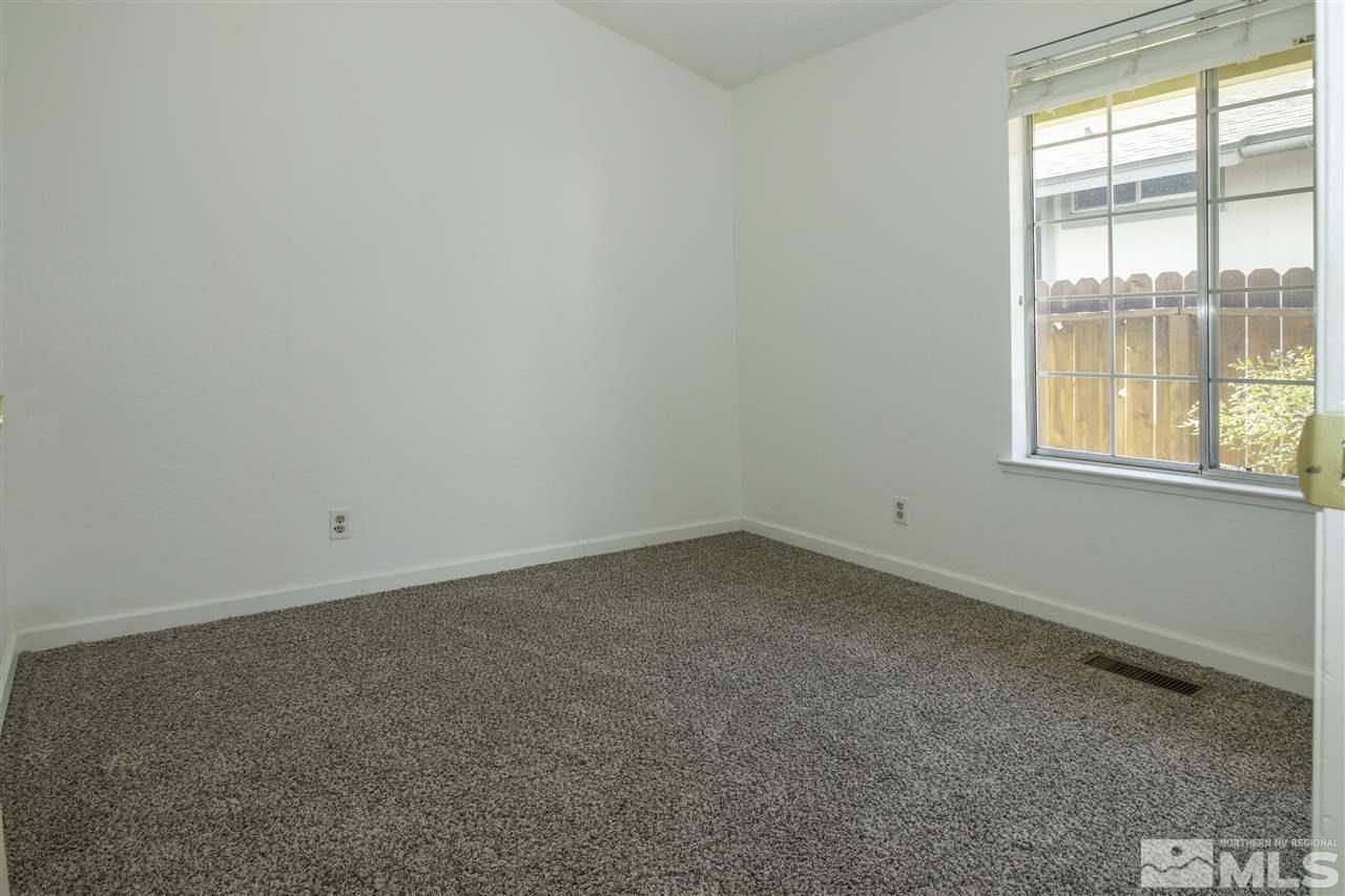 6480 Enchanted Valley Drive Reno, NV 89523 - Photo 9 of 12 an empty room with a window