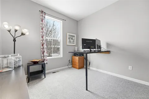 a bedroom with furniture and a window