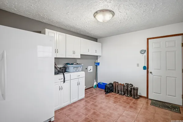 a view of a storage area with shoes and chairs
