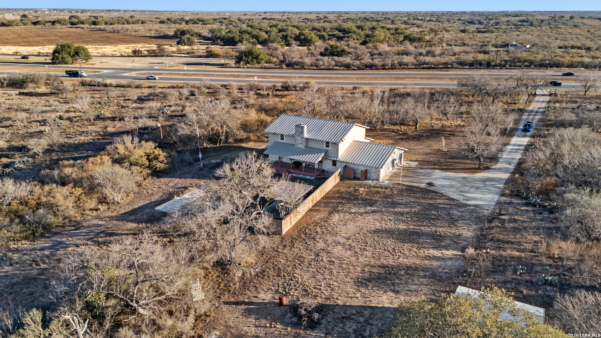 3940 Highway 90 Hondo, TX 78861 - Photo 4 of 24 an aerial view of a house with a yard