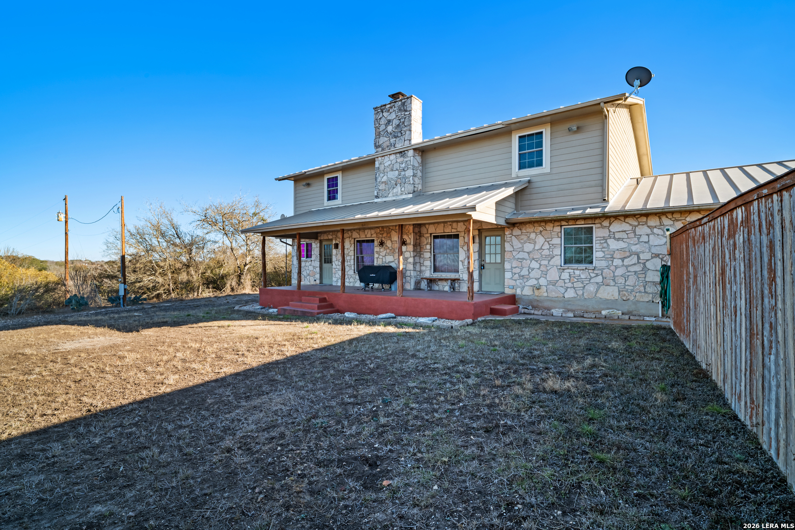3940 Highway 90 Hondo, TX 78861 - Photo 7 of 24 a front view of a house with yard and balcony