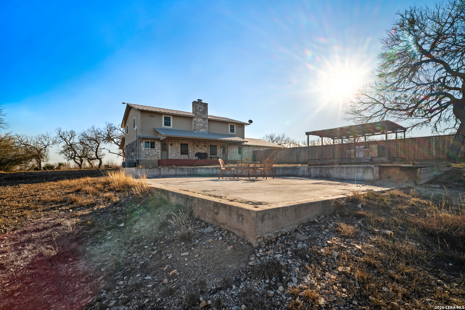 3940 Highway 90 Hondo, TX 78861 - Photo 9 of 24 a view of a house with a yard and sitting area