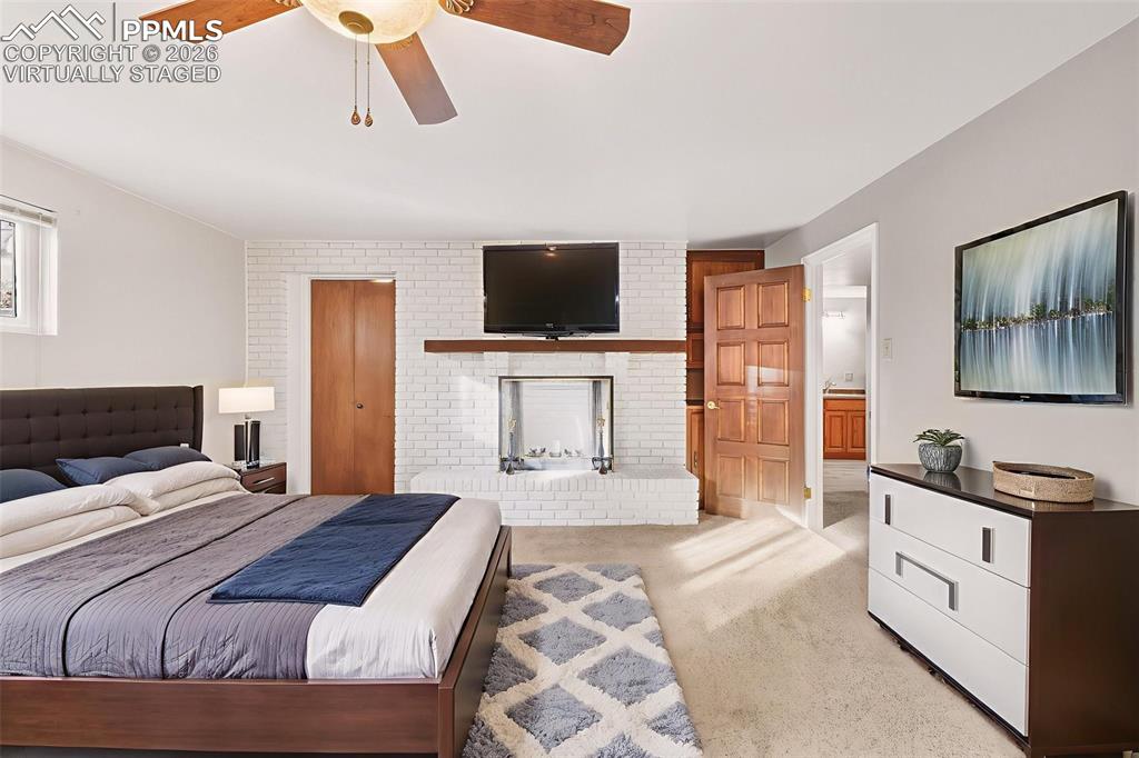 2771 Rigel Drive Colorado Springs, CO 80906 - Photo 33 of 50 (Virtually Staged) – Large basement bedroom with fire place walk in closet, ideal for guests or multi-purpose use.