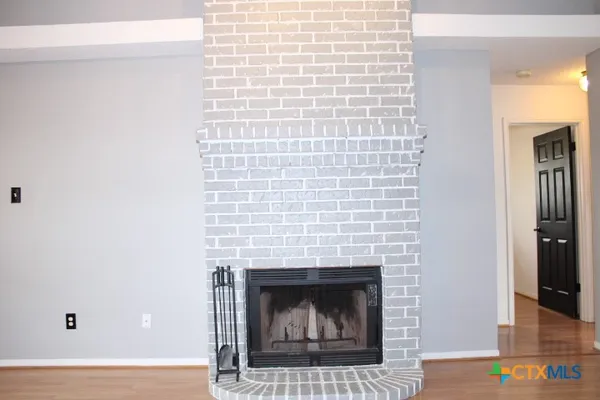 a living room with a fireplace