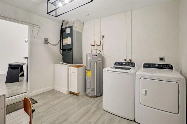 a view of a storage & utility room with washer and dryer