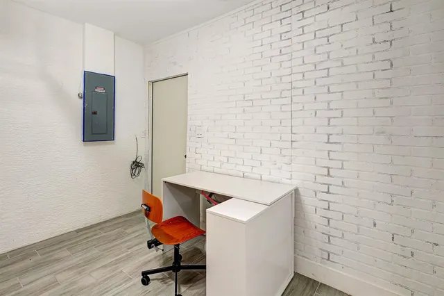 a workspace with furniture wooden floor and a sink