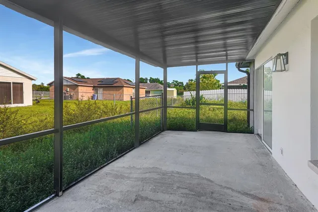 a view of a house with backyard and garden