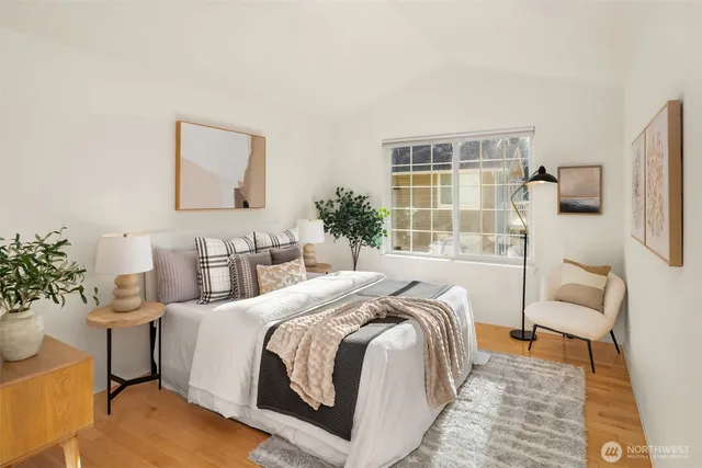 a bedroom with a bed and a couch