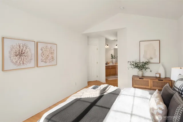 a bedroom with a bed and a couch