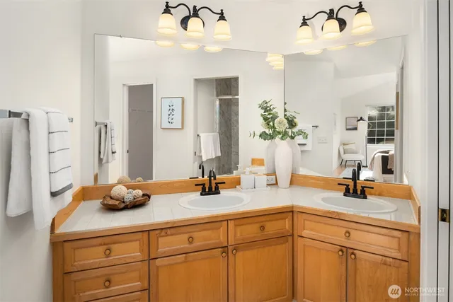 a bathroom with sink and mirror