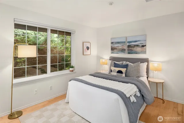 a bedroom with a bed and a window