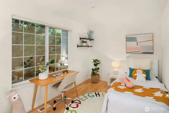 a bedroom with furniture and a window