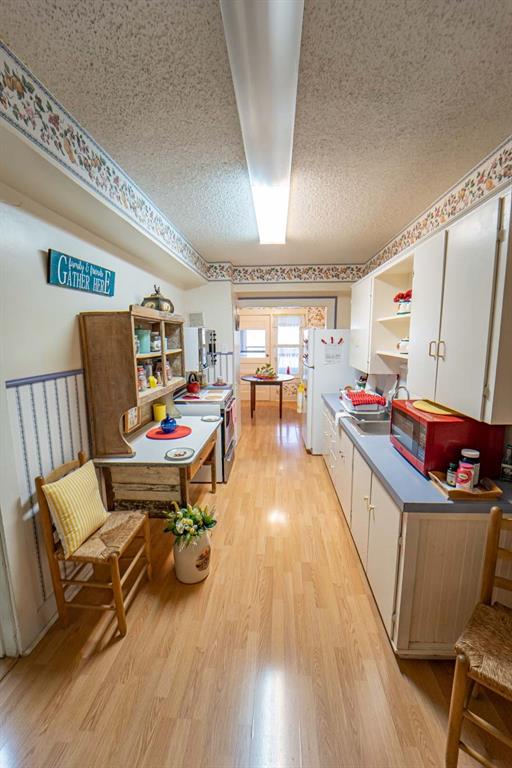 900 West Walker Street Breckenridge, TX 76424 - Photo 13 of 40 a living room with furniture and a wooden floor