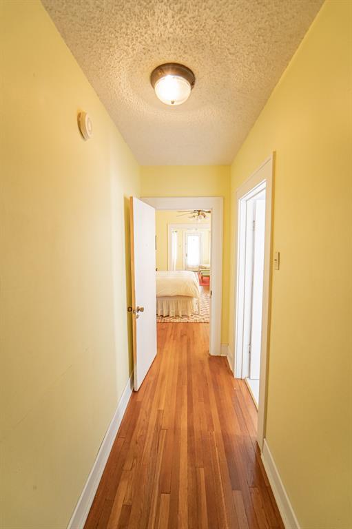 900 West Walker Street Breckenridge, TX 76424 - Photo 18 of 40 a view of a room with wooden floor