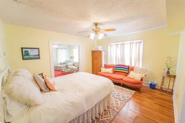 a bedroom with bed and window