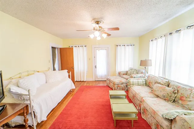 a bed room with a bed and a chandelier