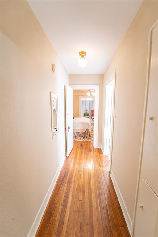 900 West Walker Street Breckenridge, TX 76424 - Photo 28 of 40 a view of a room with wooden floor