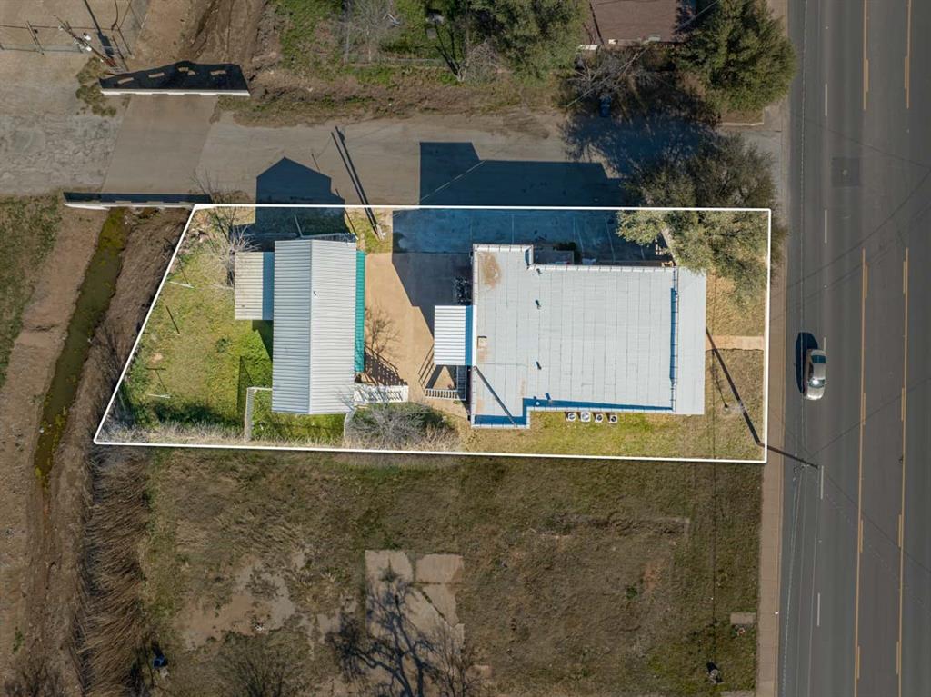 900 West Walker Street Breckenridge, TX 76424 - Photo 3 of 40 an aerial view of residential house with outdoor space