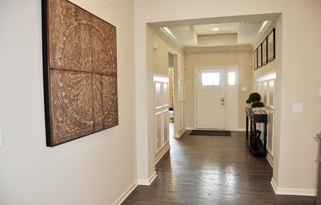 3151 Patterson Road Montgomery, IL 60538 - Photo 3 of 10 a view of a hallway with wooden floor and a workspace
