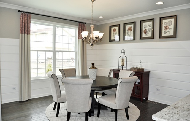 3151 Patterson Road Montgomery, IL 60538 - Photo 6 of 10 a view of a dining room with furniture window and wooden floor