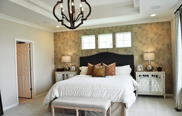 3151 Patterson Road Montgomery, IL 60538 - Photo 8 of 10 a bedroom with a bed and a chandelier